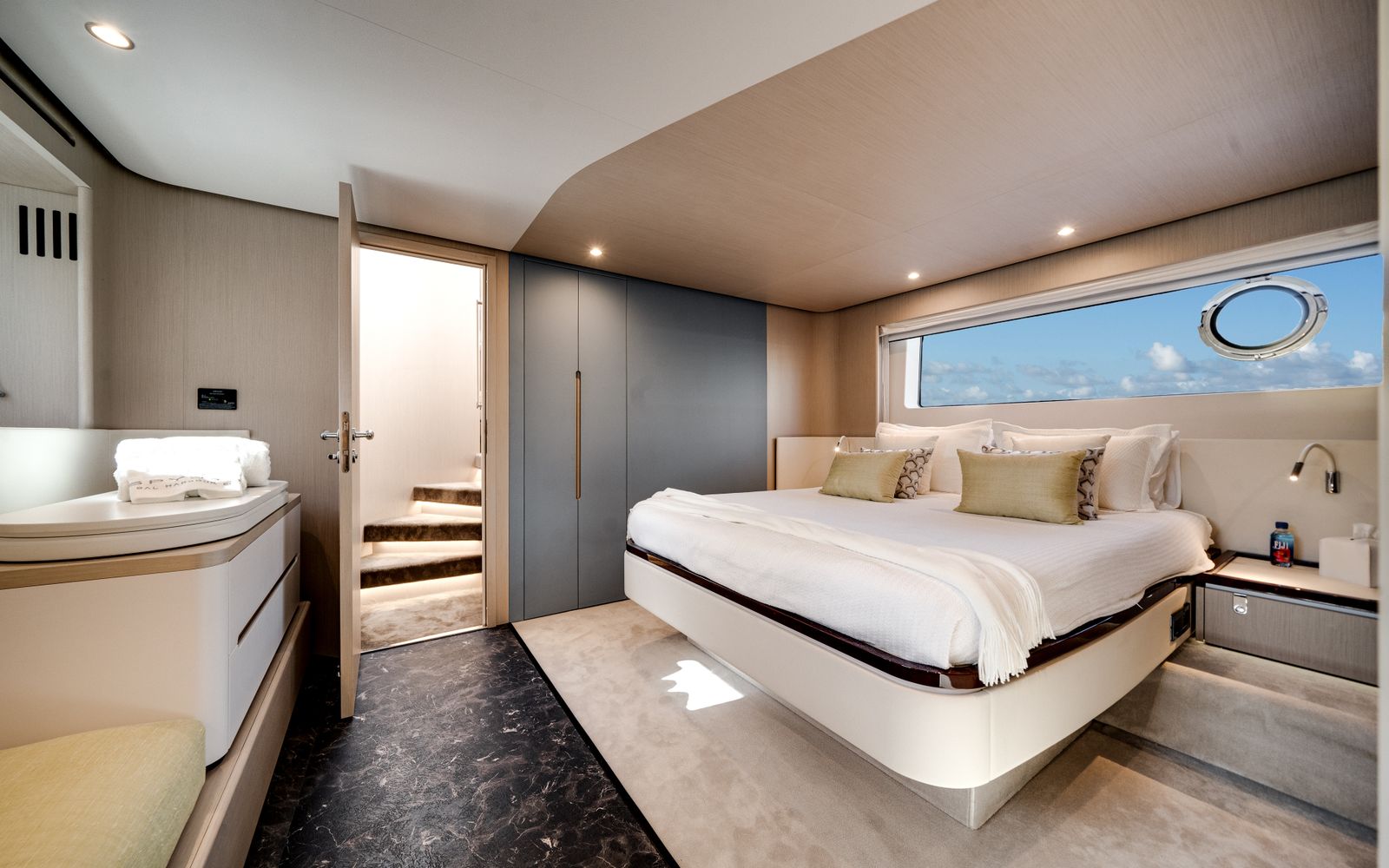 Azimut Fly 68 owner's cabin with king bed and hull window